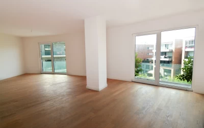 interior-look-of-an-empty-living-room-from-the-project-having-two-seperate-windows-with-the-view-of-other-apartments