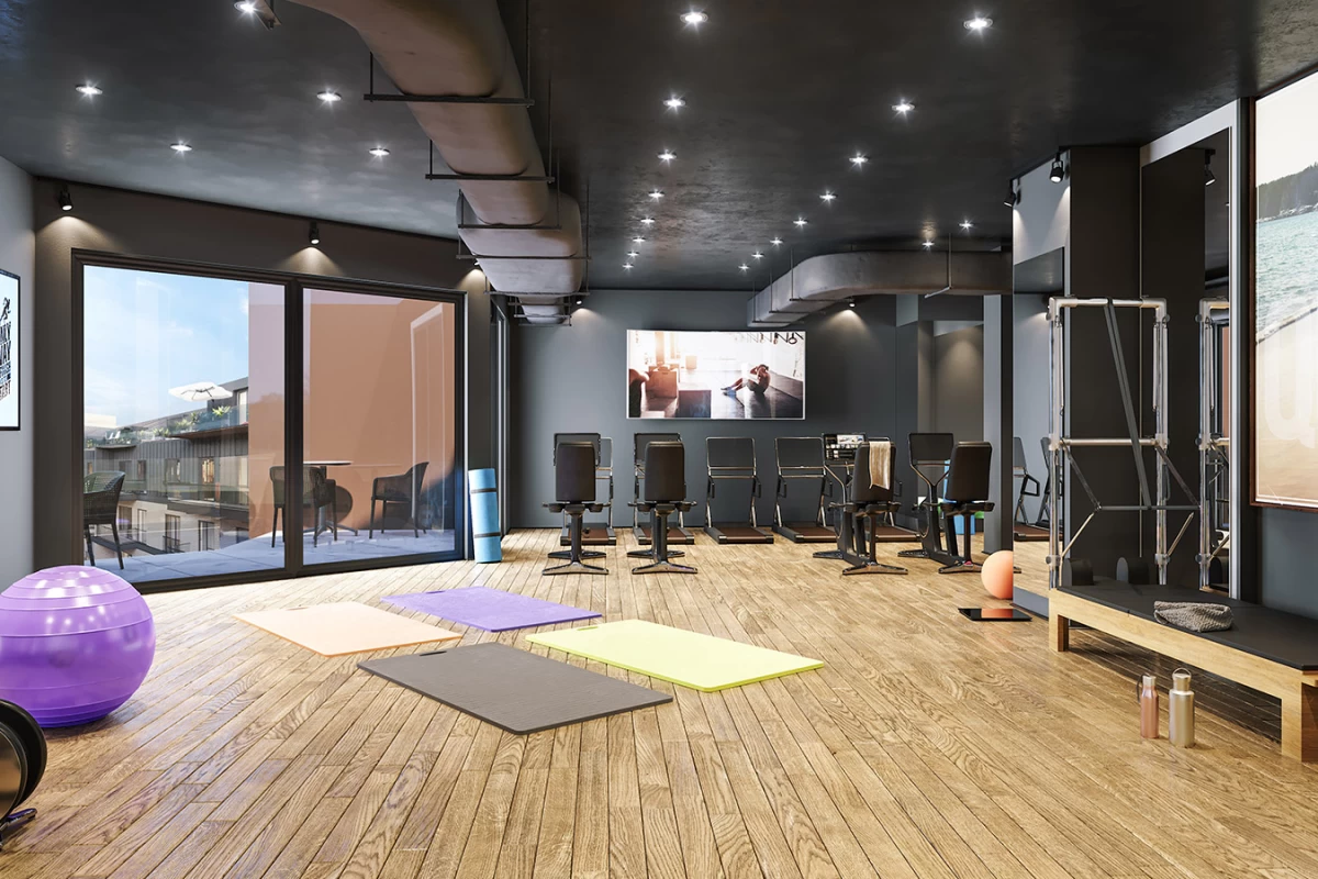 interior-view-of-the-spacious-and-full-of-equipment-fitness-center-having-floor-to-ceiling-window-in-the-residential-project