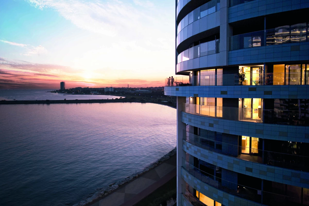 exterior-and-side-view-of-the-spine-like-residential-unit-in-which-the-coastline-and-amazing-sunset-can-be-seen
