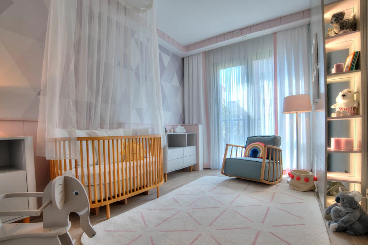 pretty-design-luminous-baby-room-with-cradle-with-white-curtains-a-decorative-library-with-cute-toys-in-kadikoy