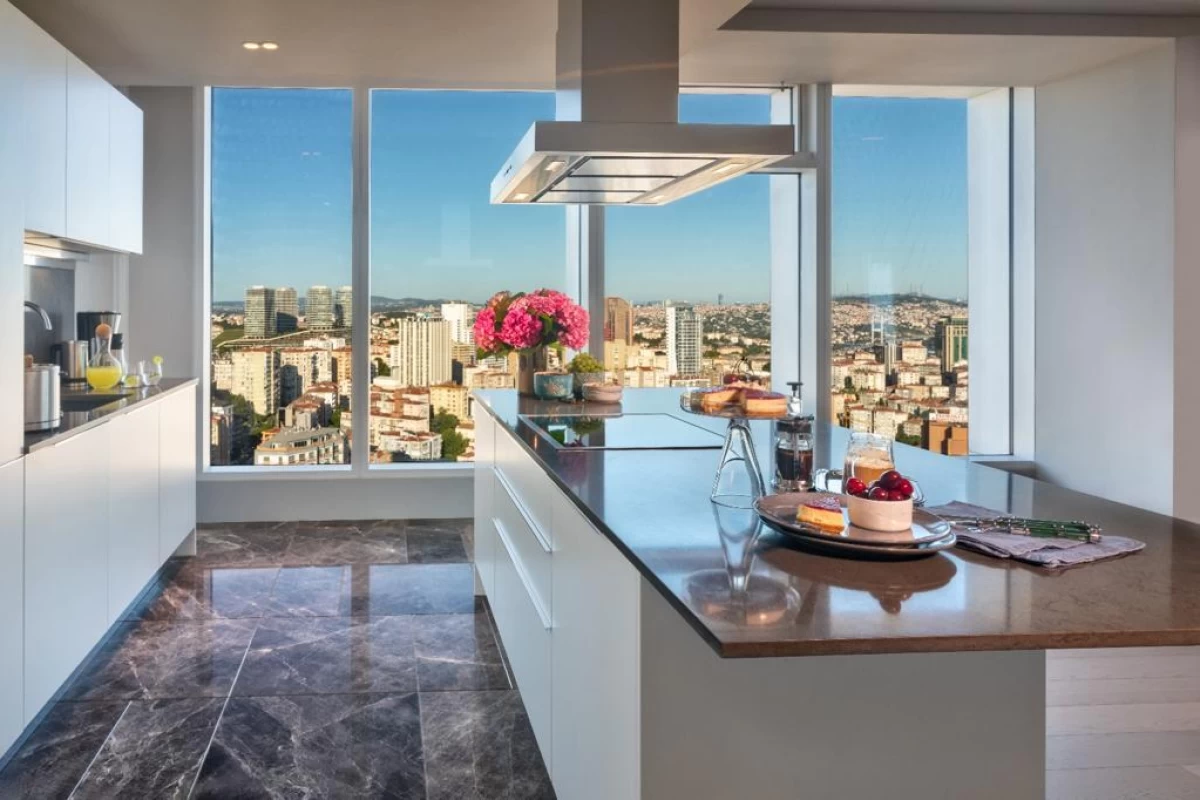 interior-view-of-the-spacious-luminous-and-exquisite-kitchen-having-floor-to-ceiling-large-window-with-city-view