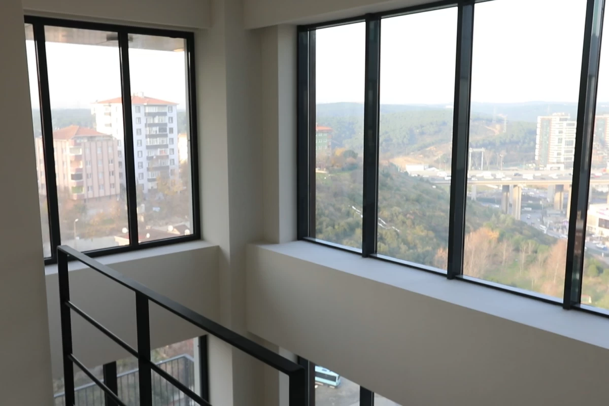 interior-view-of-the-corridor-of-the-residential-building-project-having-floor-to-ceiling-windows-on-each-floor-with-forest-view