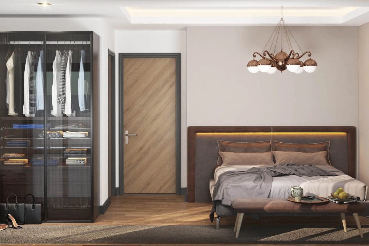 elegant-and-luxurious-bedroom-designed-in-brown-shades-with-a-comfy-bed-pendant-lights-transparent-closet-and-bags-and-shoe-on-the-floor