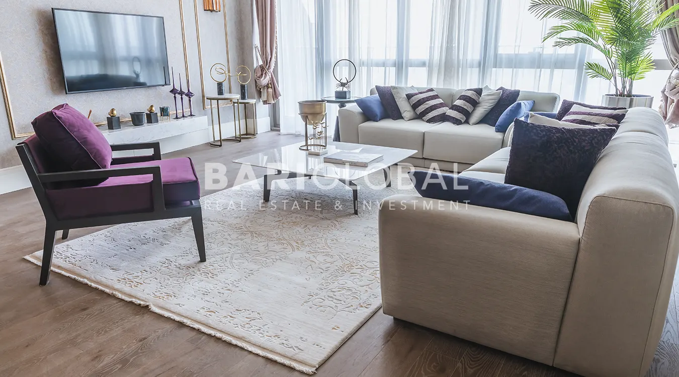 interior-view-of-the-minimalistic-and-modern-living-room-with-two-coaches-a-purple-armchair-a-central-table-and-tv-unit